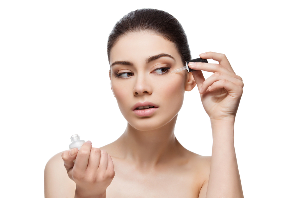 Woman Applying Serum to Skin Anti-Aging