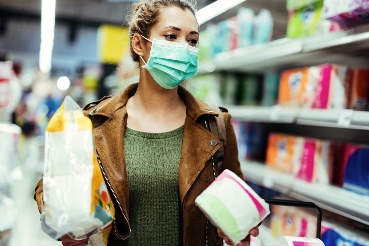 Woman wearing a mask while shopping in store