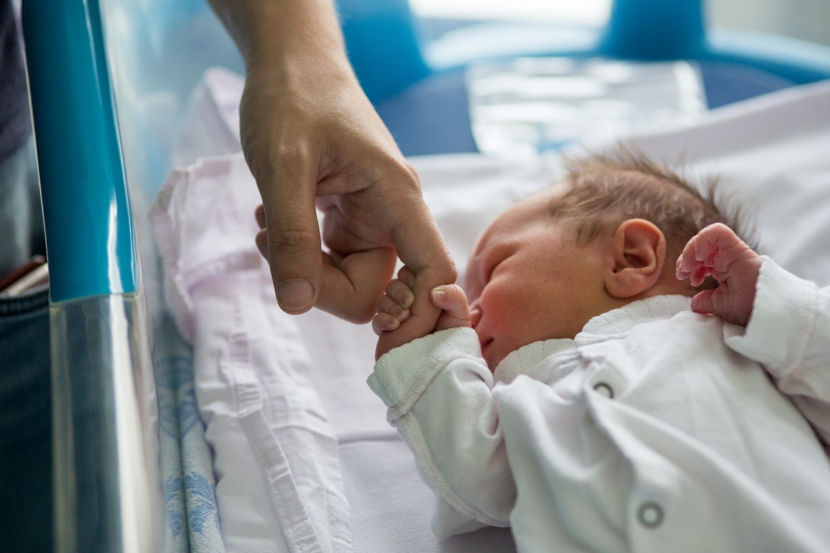 baby sleeping in infant sleeper