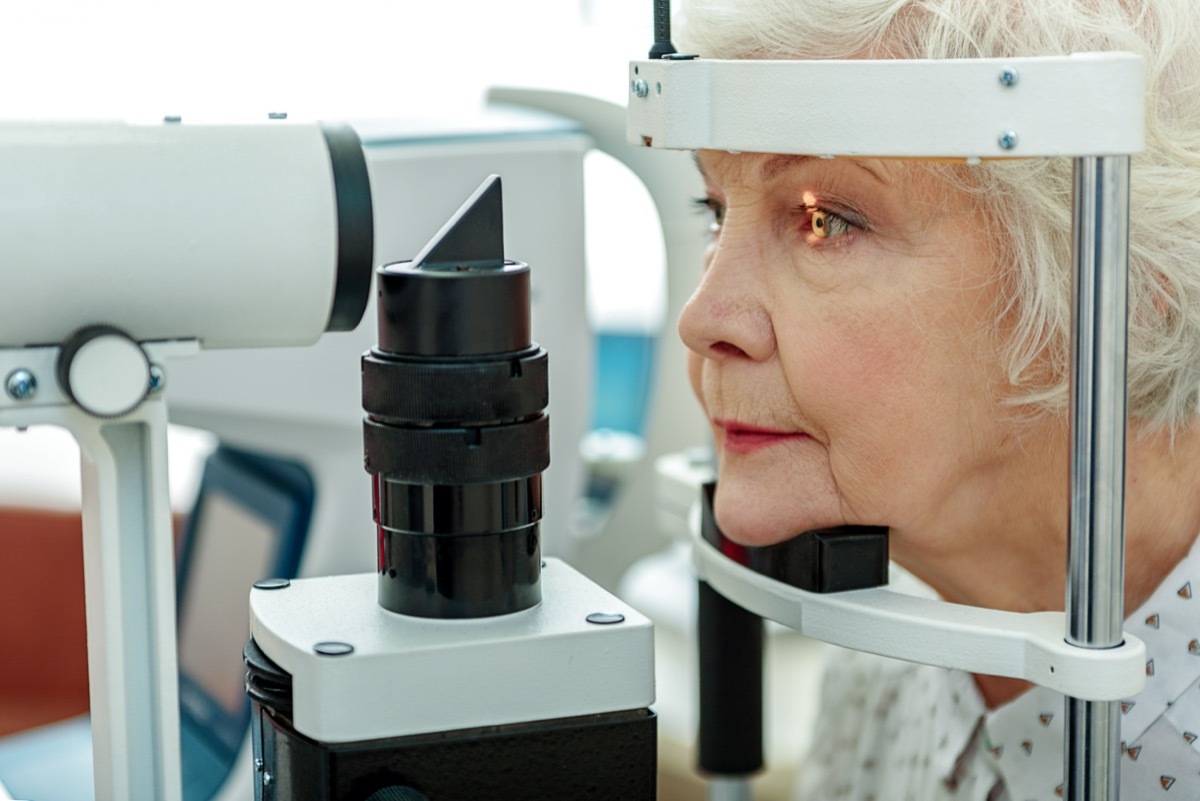 Sight of old woman verifying by apparatus