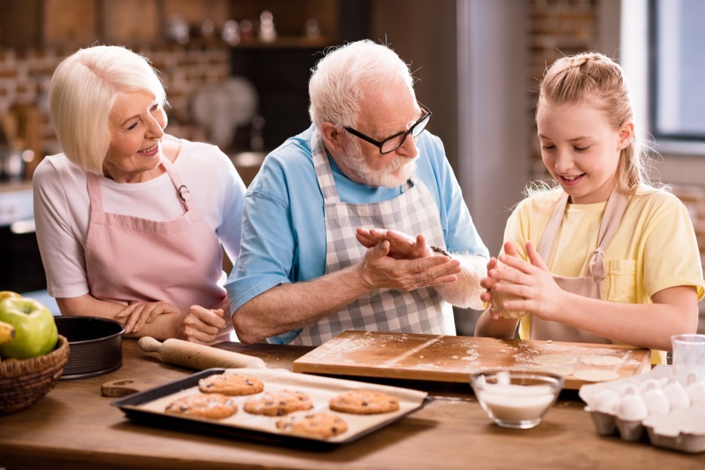 Grandma and grandkids cooking.