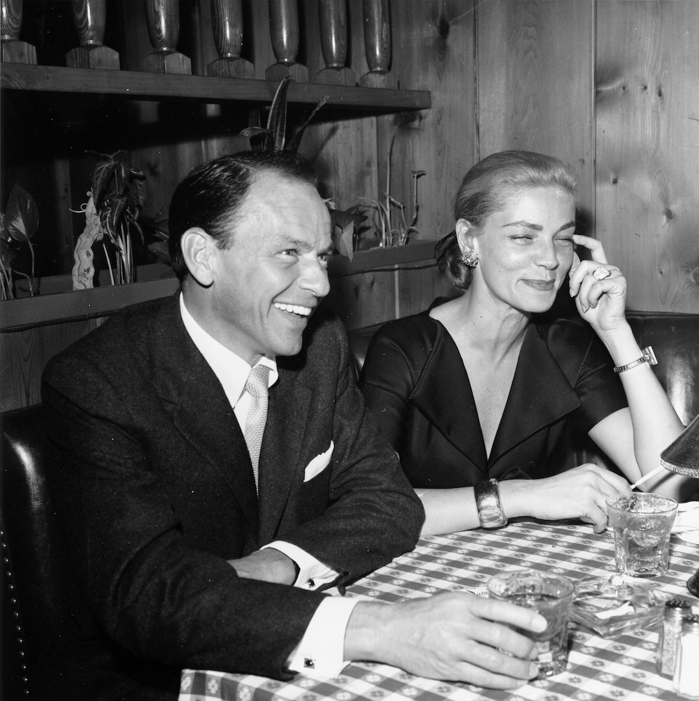 Frank Sinatra and Lauren Bacall at a party in 1957