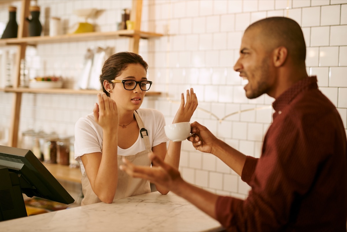 barista getting nervous with an upset customer yelling