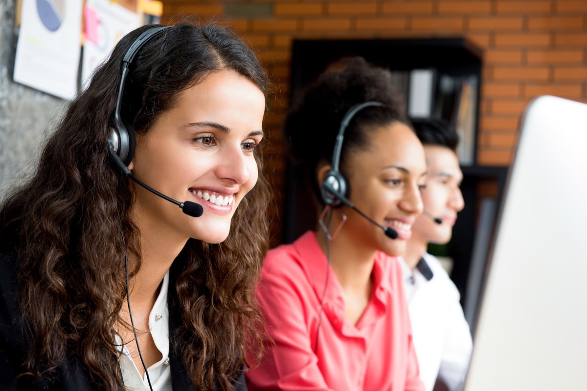 group of telemarketers taking calls at work