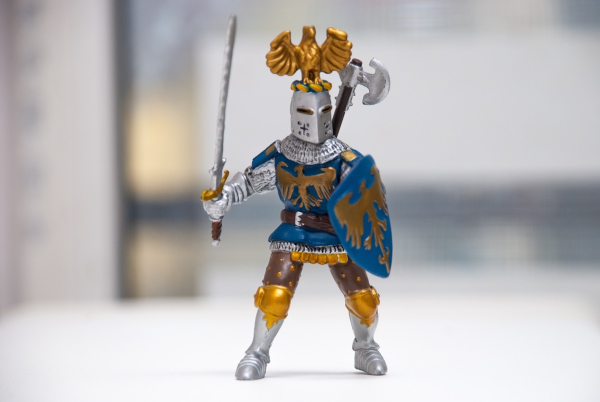 an action figure size toy wearing battle armor and holding a sword