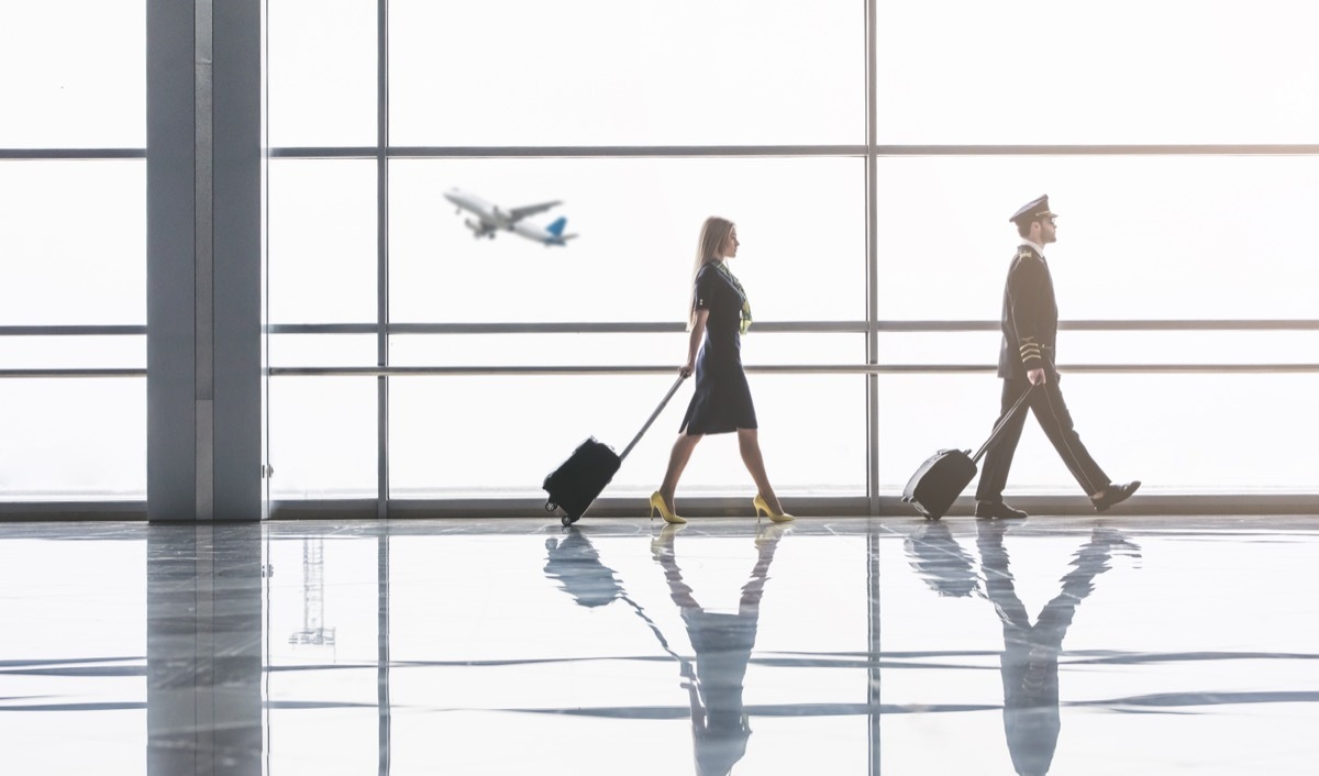 pilot and flight attendant in airport