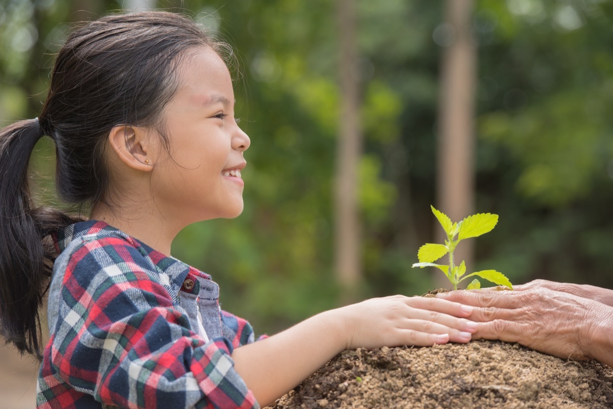 young asian girl gardening