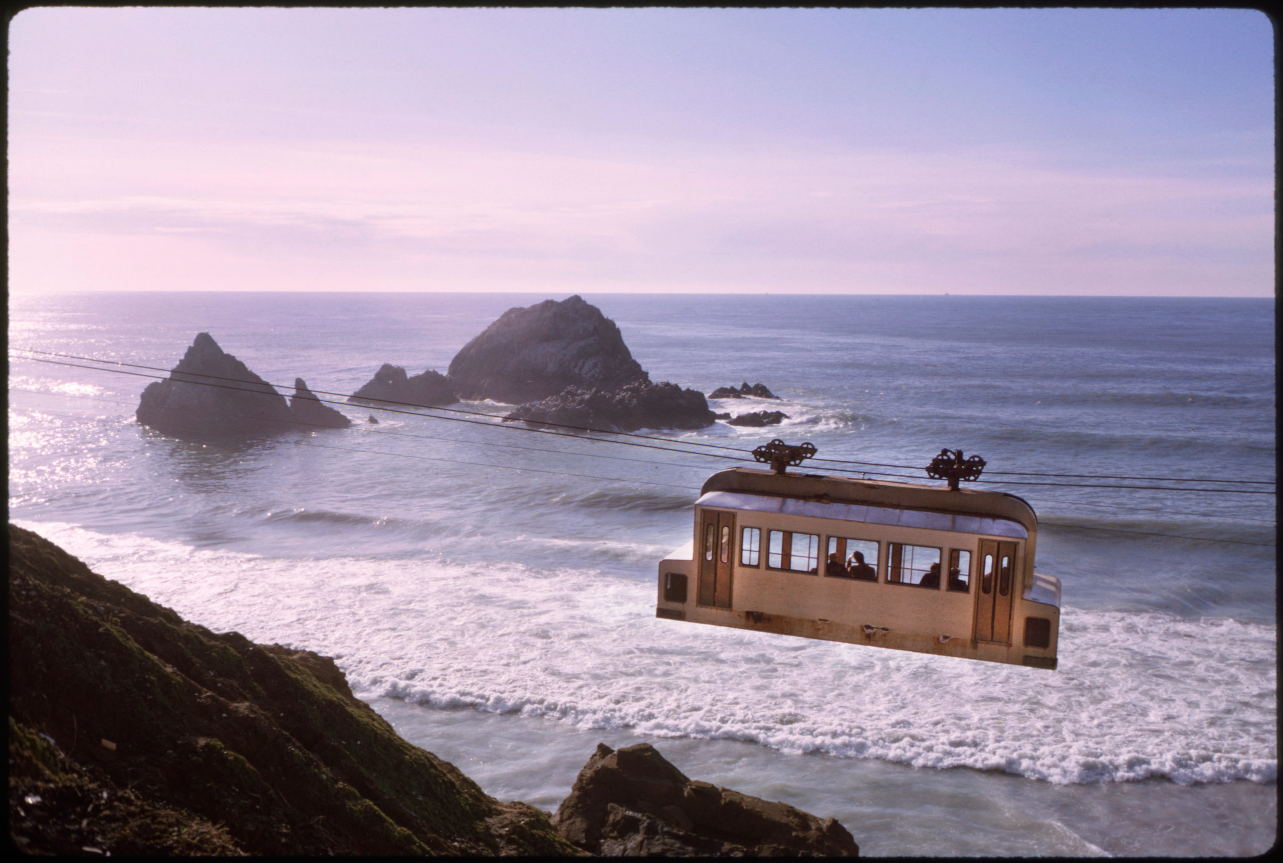 a sky tram crosses the coast of california in the 1960s