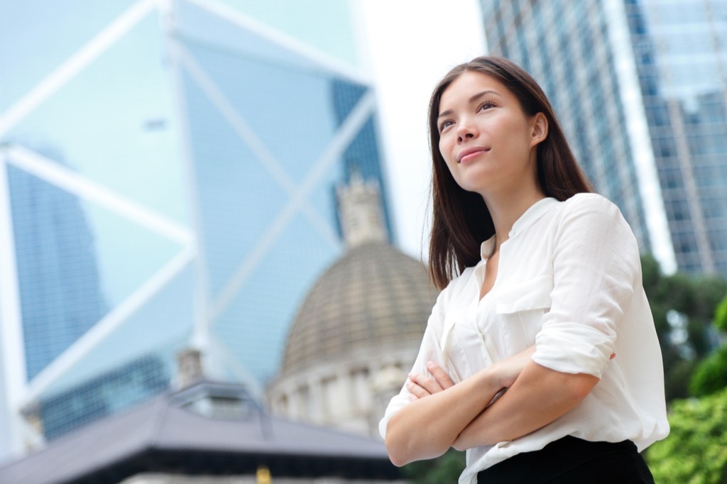 business woman standing tall