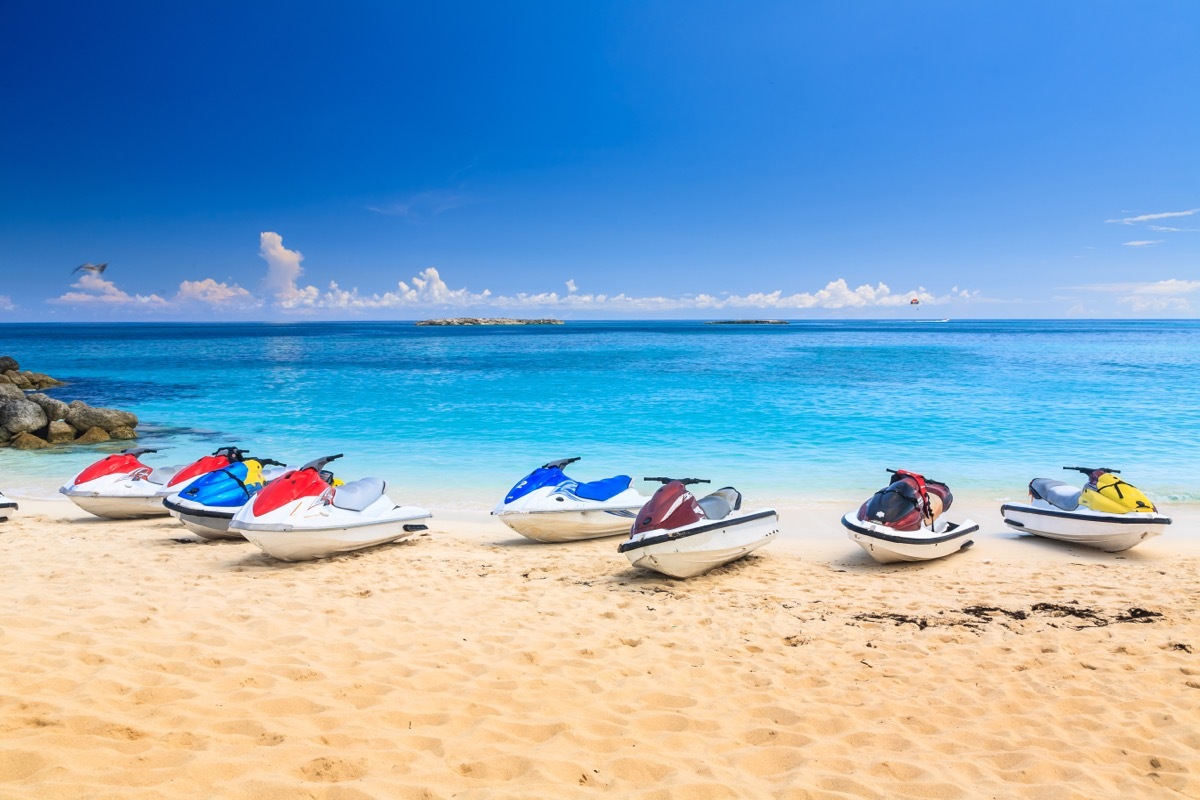 Row of Jet-skis on the beach