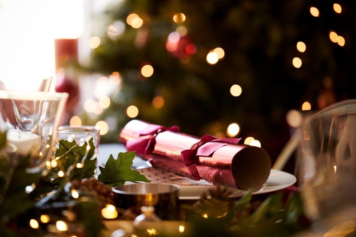 Christmas cracker on plate at Christmas dinner