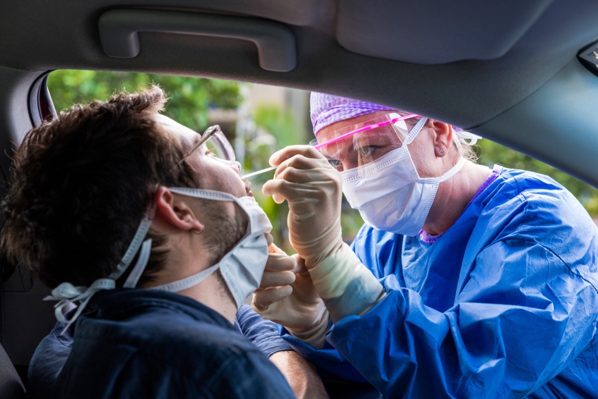 Man getting coronavirus test from car