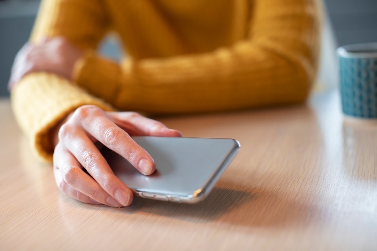 Woman putting phone down