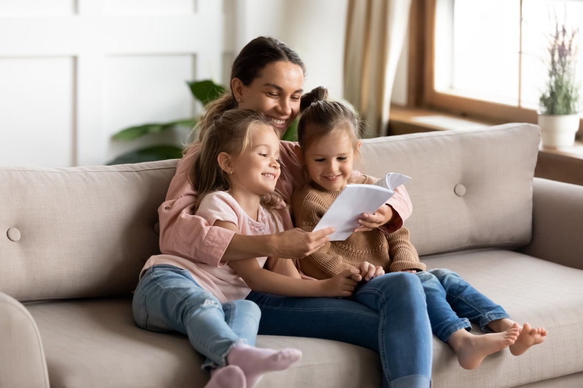 mother reading book to children