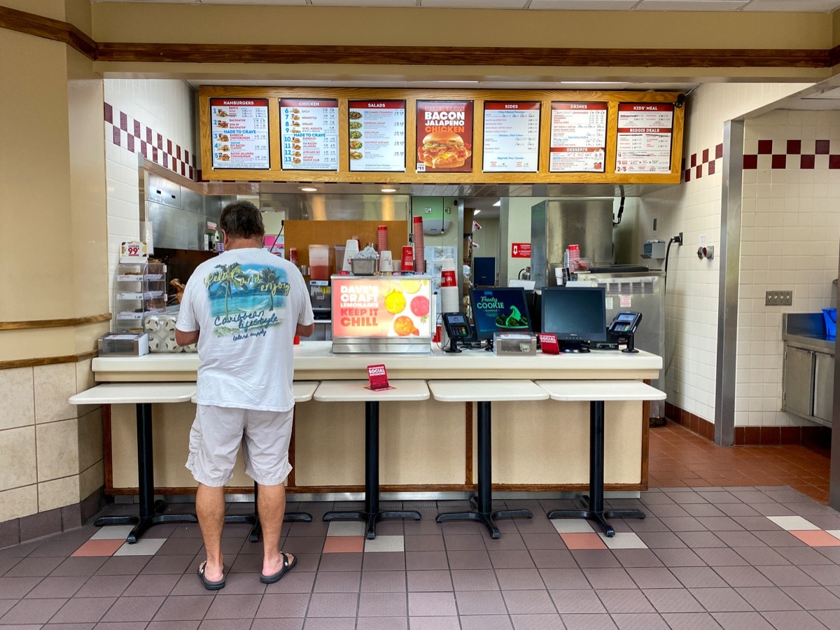 Orlando, FL/USA - 6/5/20: A Wendy's interior with social distancing information on the tables.