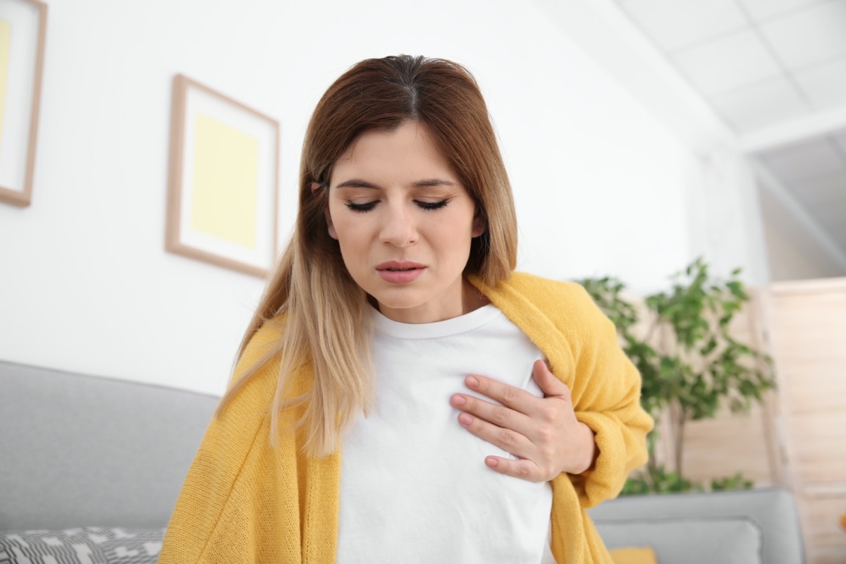 Woman having heart attack at home