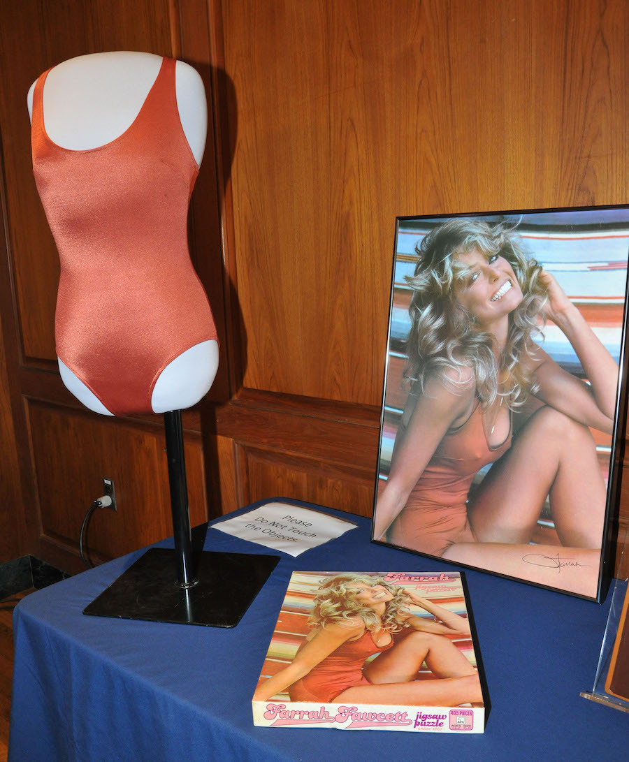 Farrah Fawcett's swimsuit, poster, and a puzzle of the photograph in the National Museum of American History in 2011