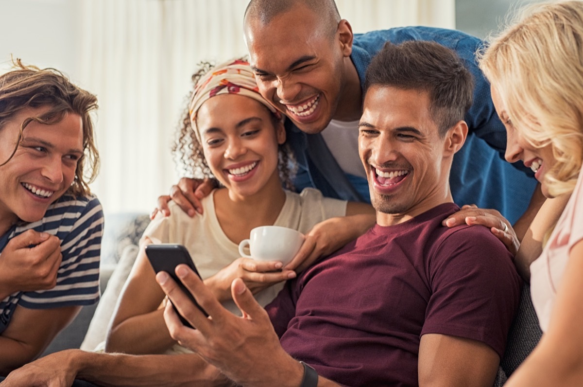 man laughing at phone, 2019 memes