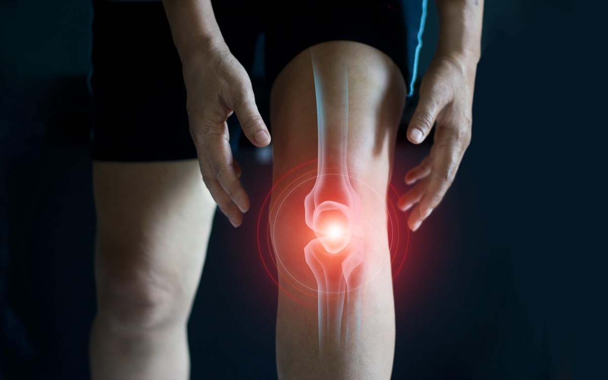 Elderly woman suffering from pain in knee