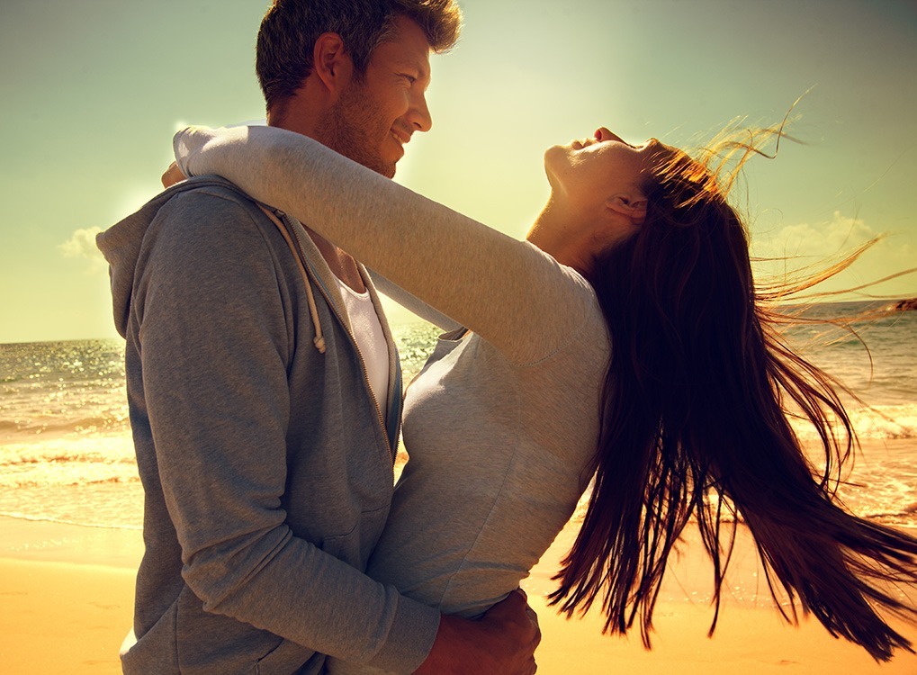 Couple on the Beach Signs Your Hair Will Go Gray