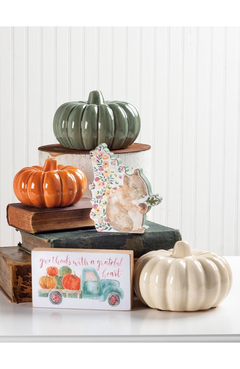 ceramic pumpkins on a side table, fall home decor