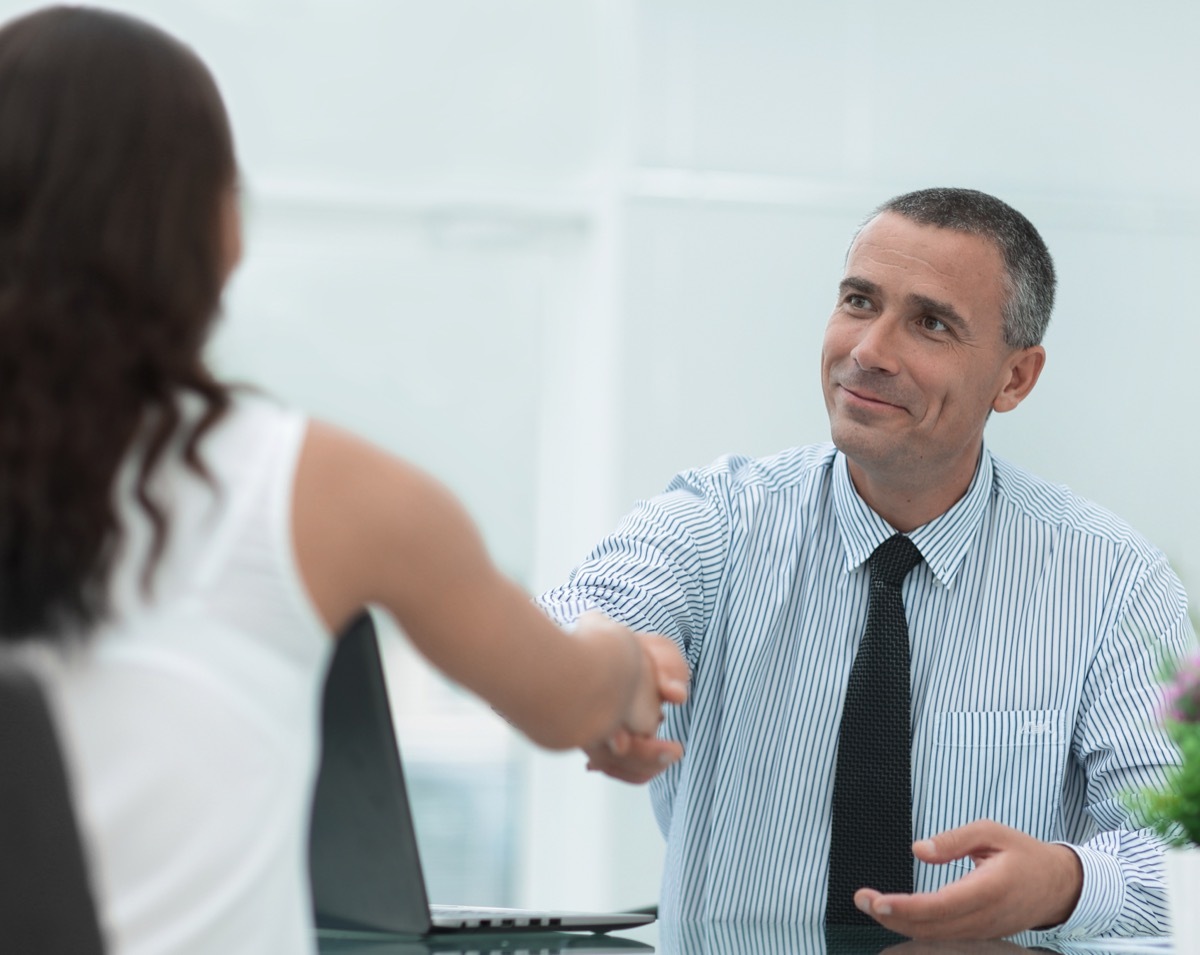 man shaking hands with customer service