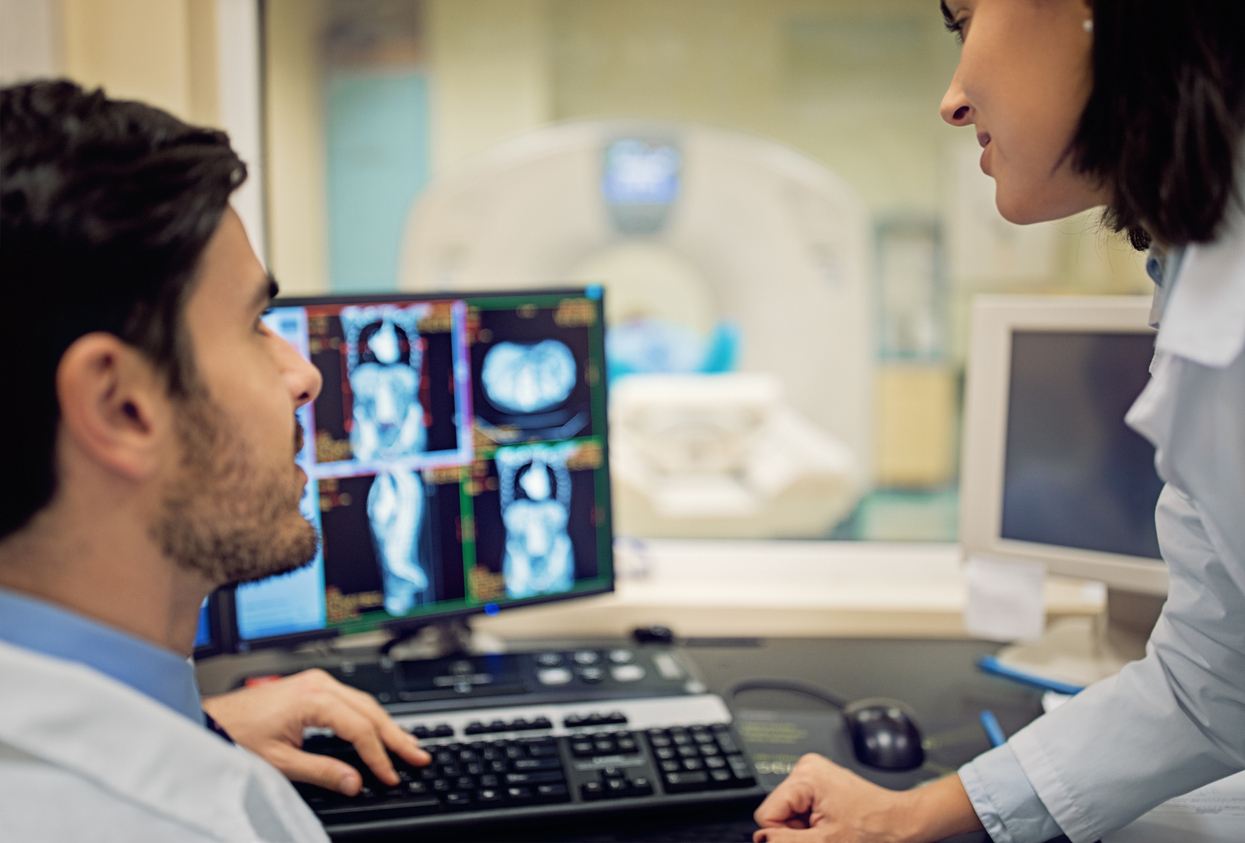 Doctors looking at brain scans. 