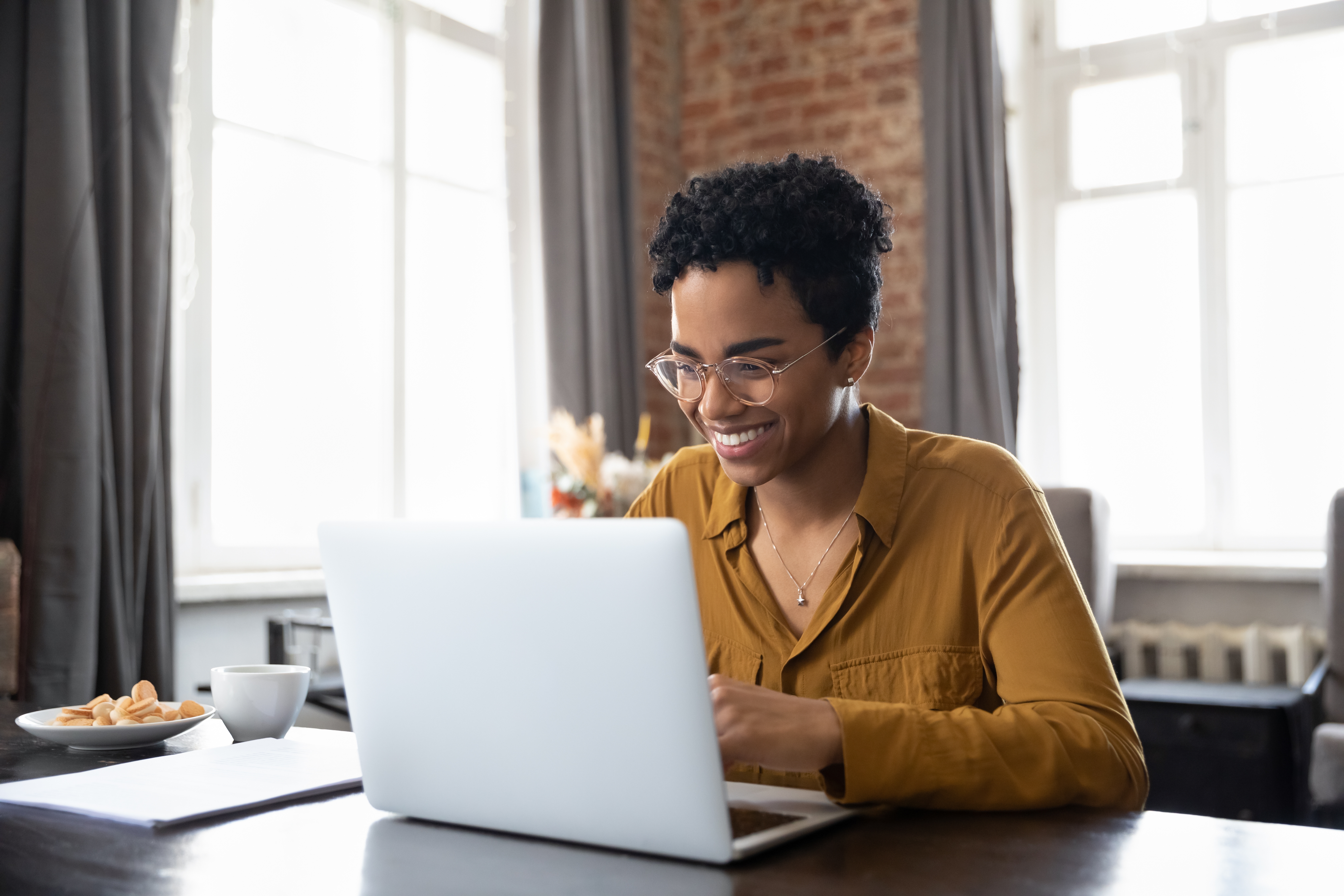 woman sitting in front of her laptop - things to do when bored