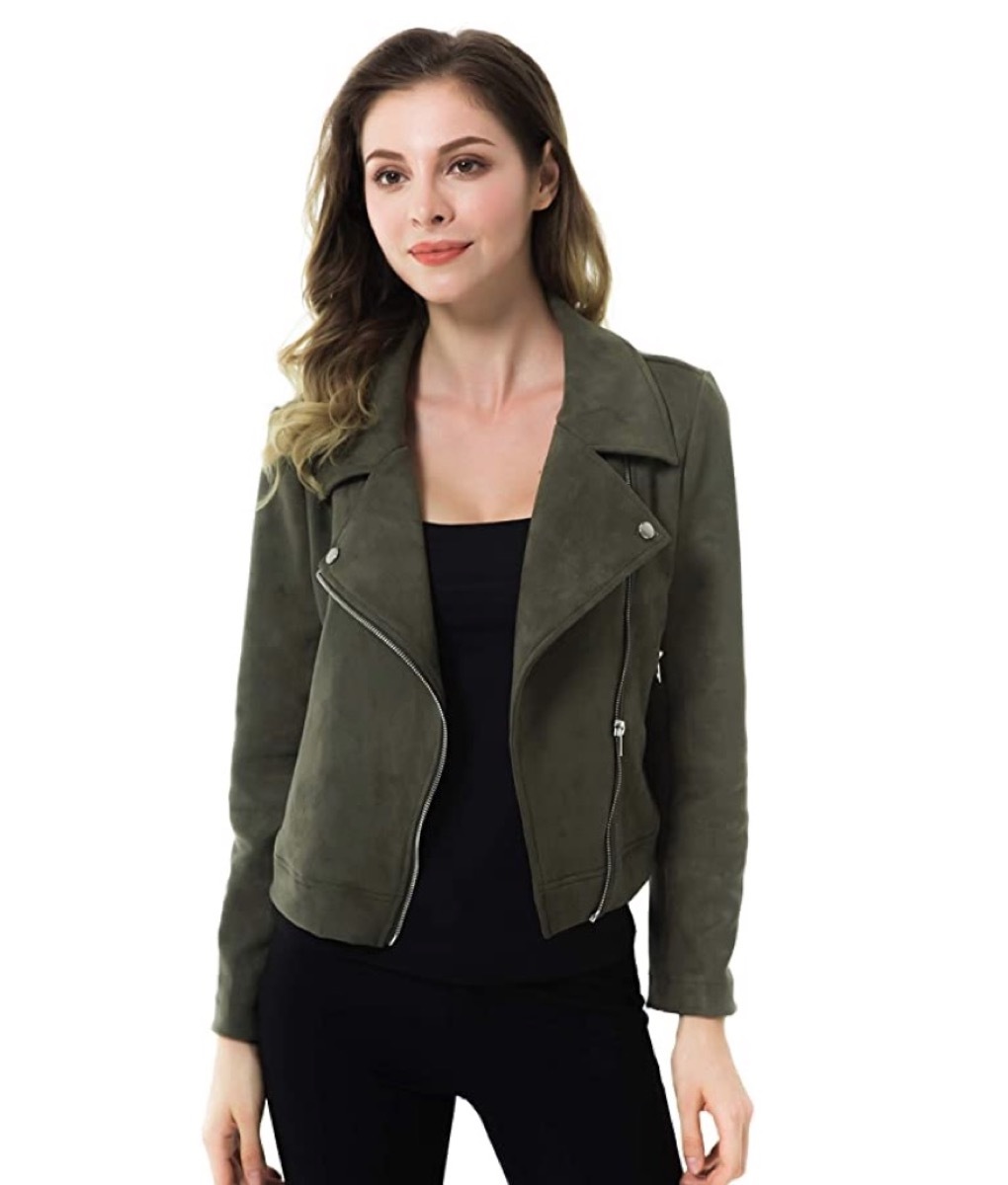 young white woman in green cropped jacket