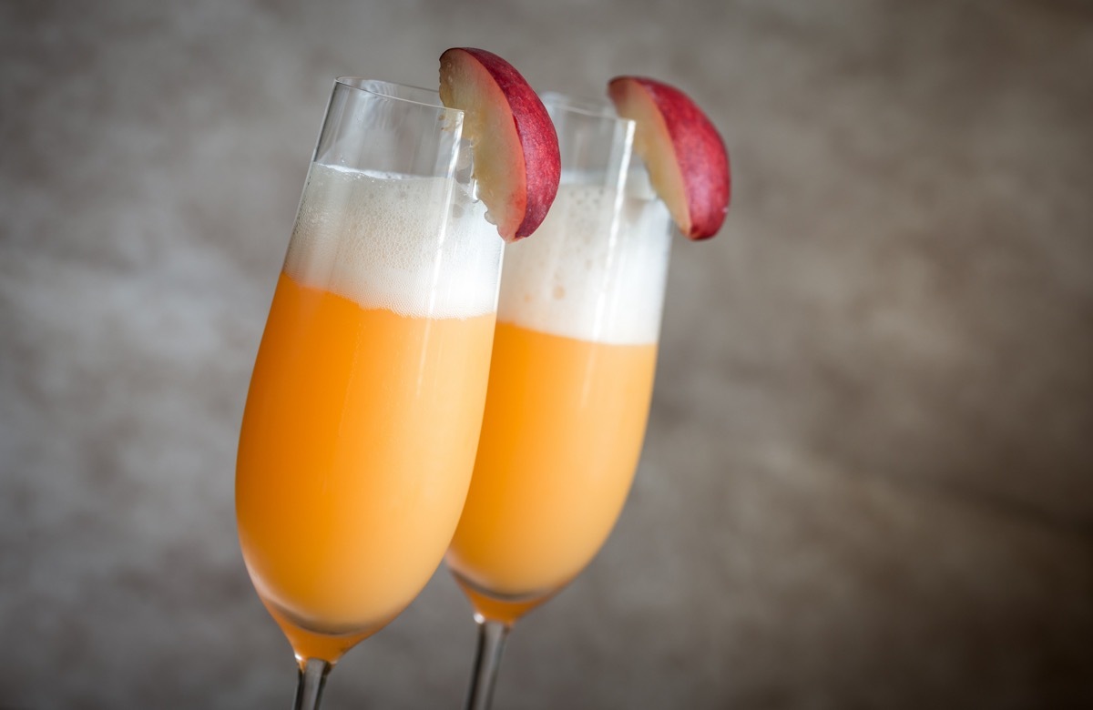 two bellini cocktails with peach