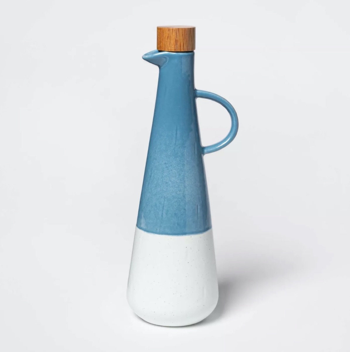 blue and white olive oil bottle with cork