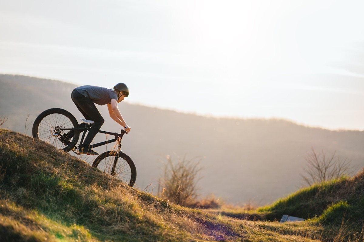 A man on a mountain bike rides downhill