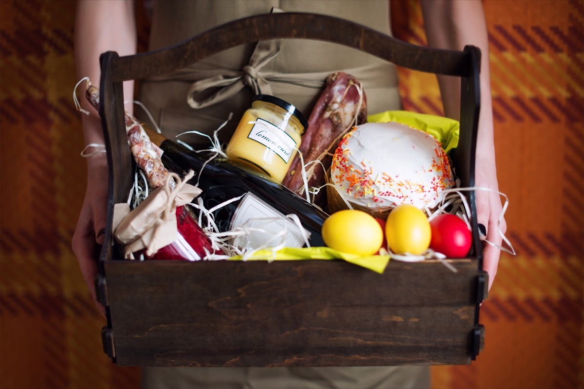 white woman holding gift basket