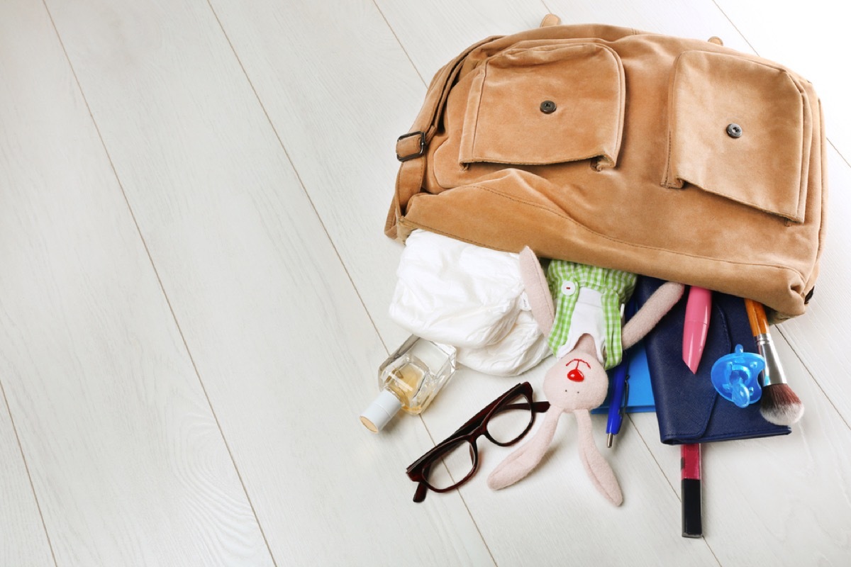 purse with toy in it, working mom