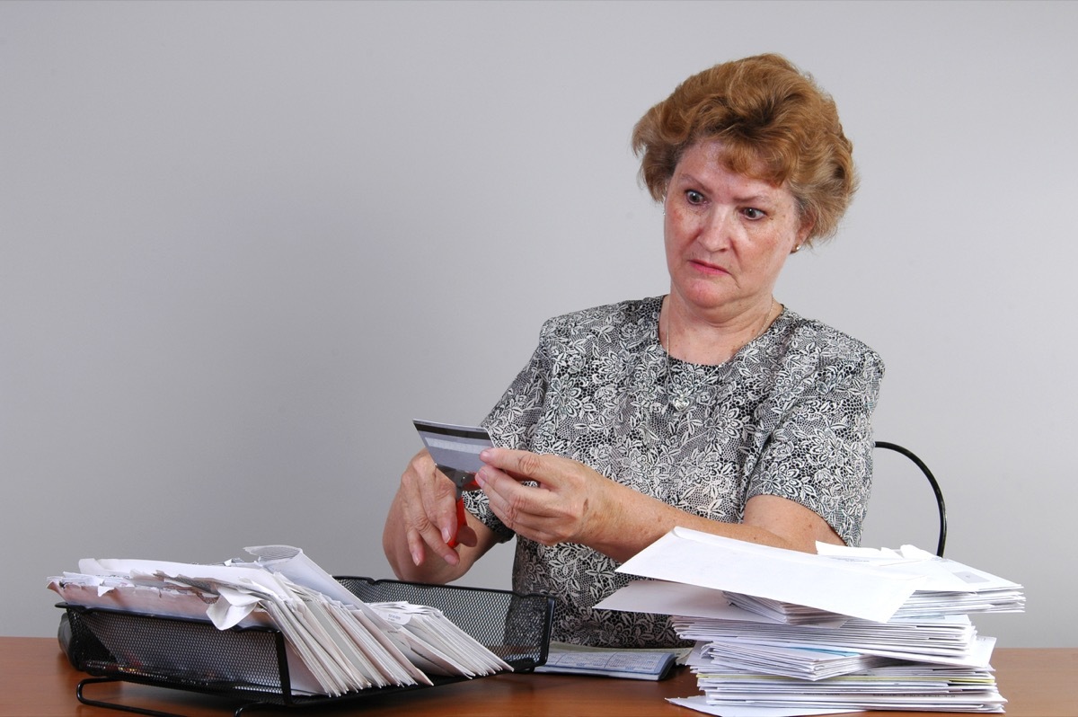 Older woman with bills