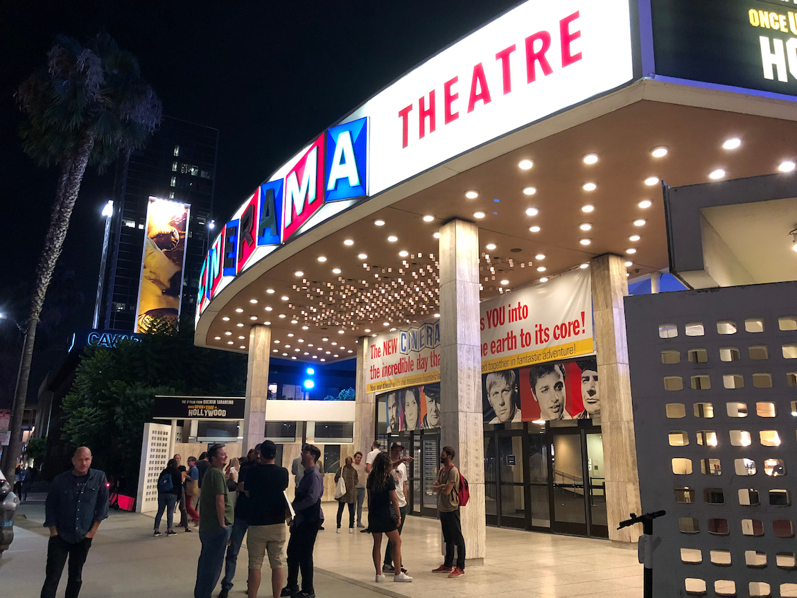 Guests standing in front of the Cinerama Dome in 2019 