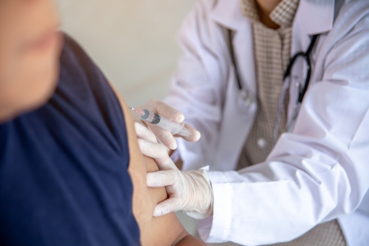 man getting a flu shot at the doctor