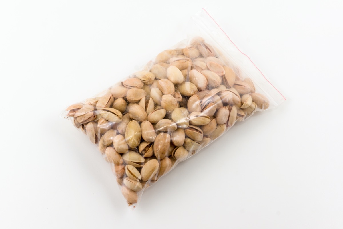 transparent plastic package full of dry pistachios