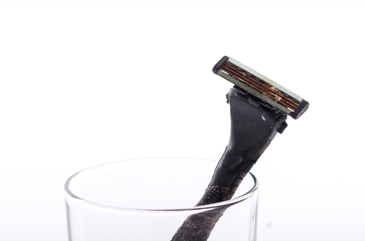 rusty razor in cup