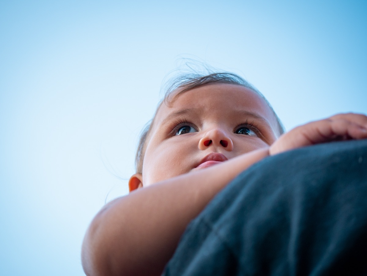 baby with a hawaiian name looking up at the sky