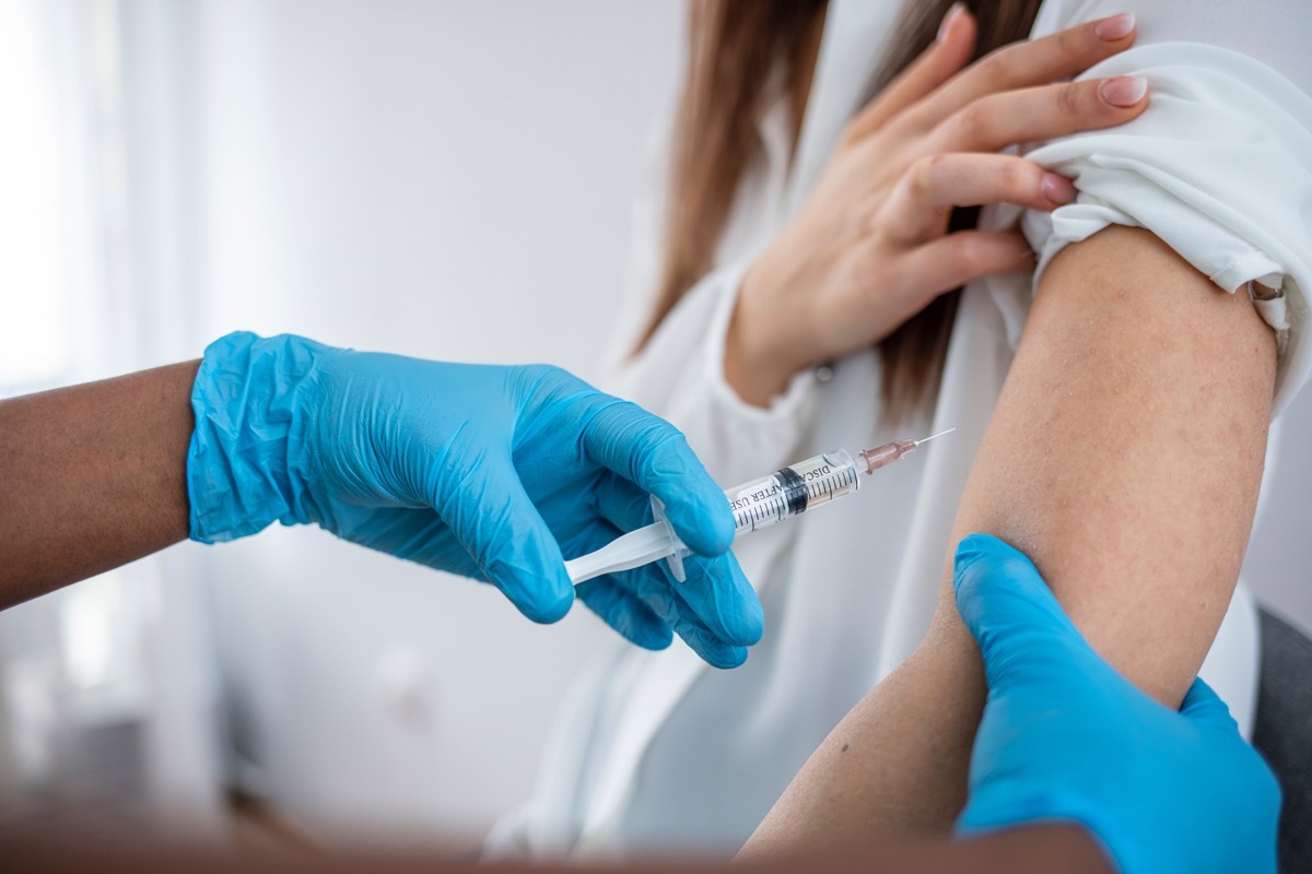 Woman getting COVID vaccine