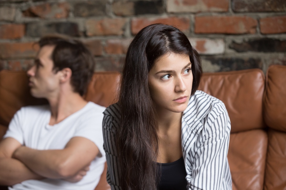 Woman in striped shirt ignoring her boyfriend.