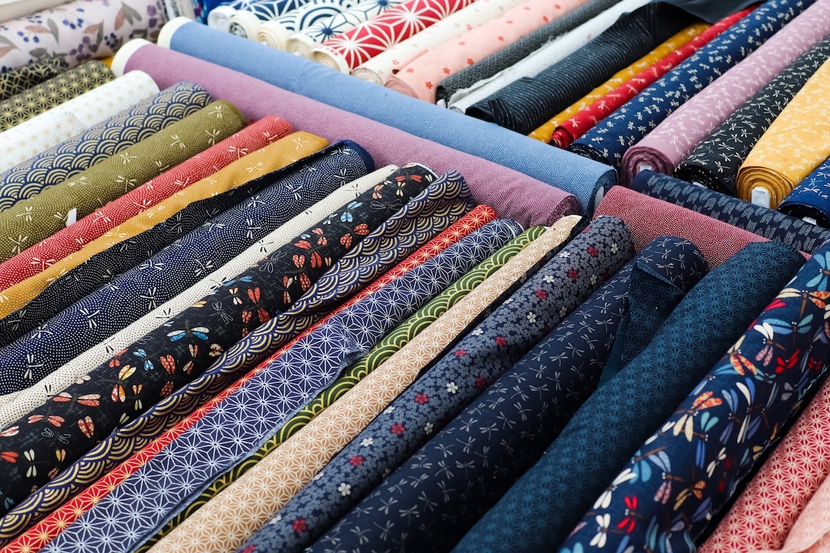 Detailed close up view on samples of cloth and fabrics in different colors found at a fabrics market.