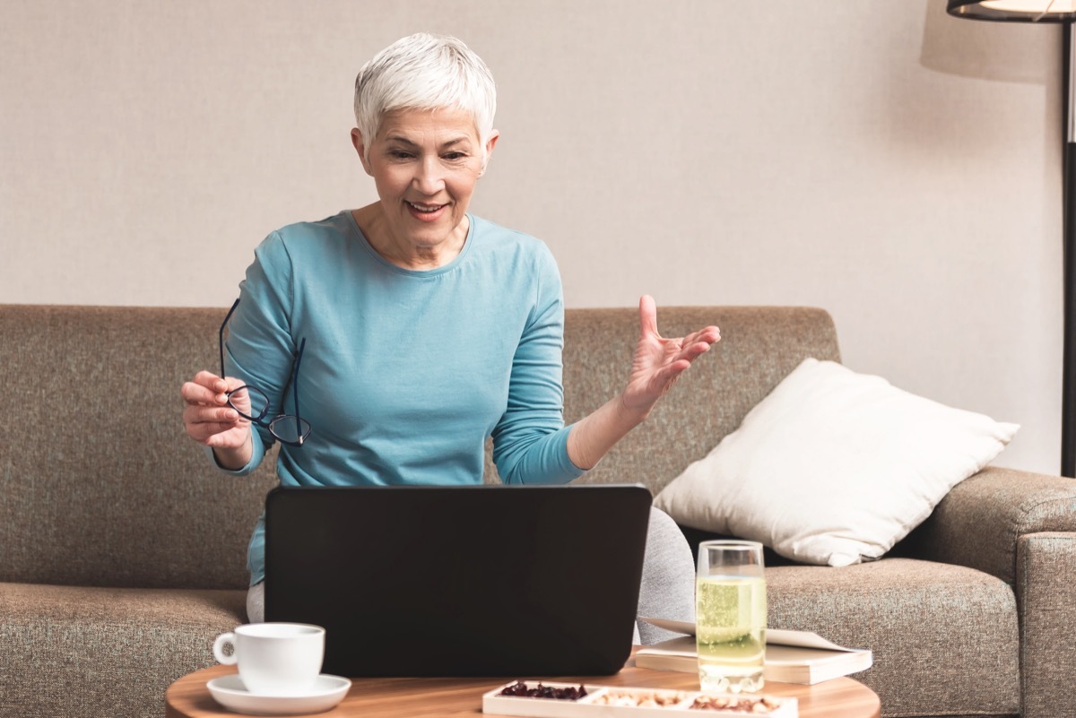 older white woman talking with her hands on video call