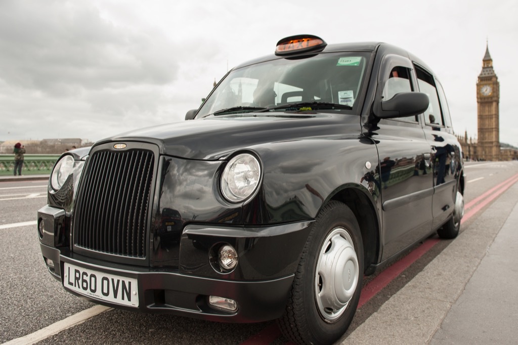 London cab driving away from Big Ben