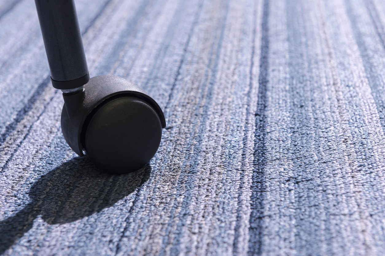 Close up of the Chair roller on the carpet 