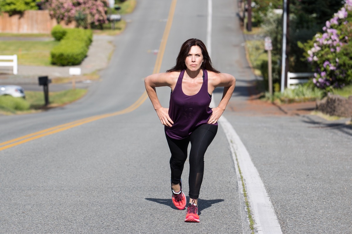 strong woman walking uphill