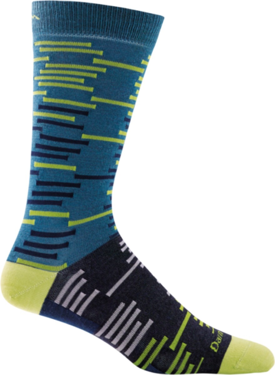 green and black socks on white background