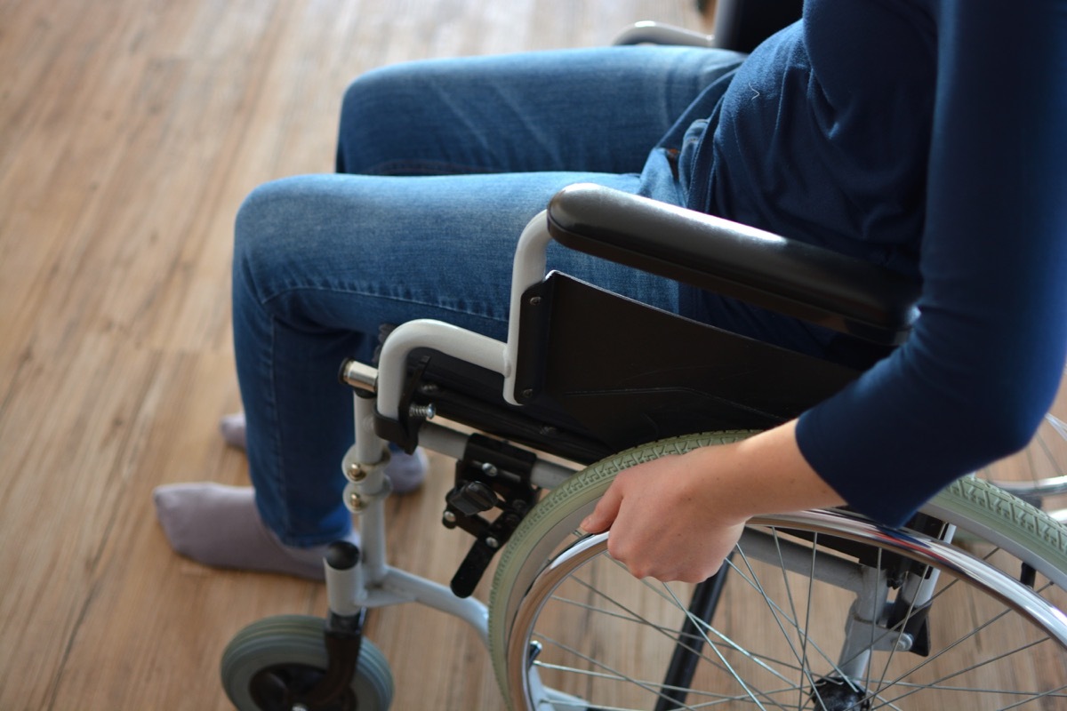 Young woman sitting in a wheelchair