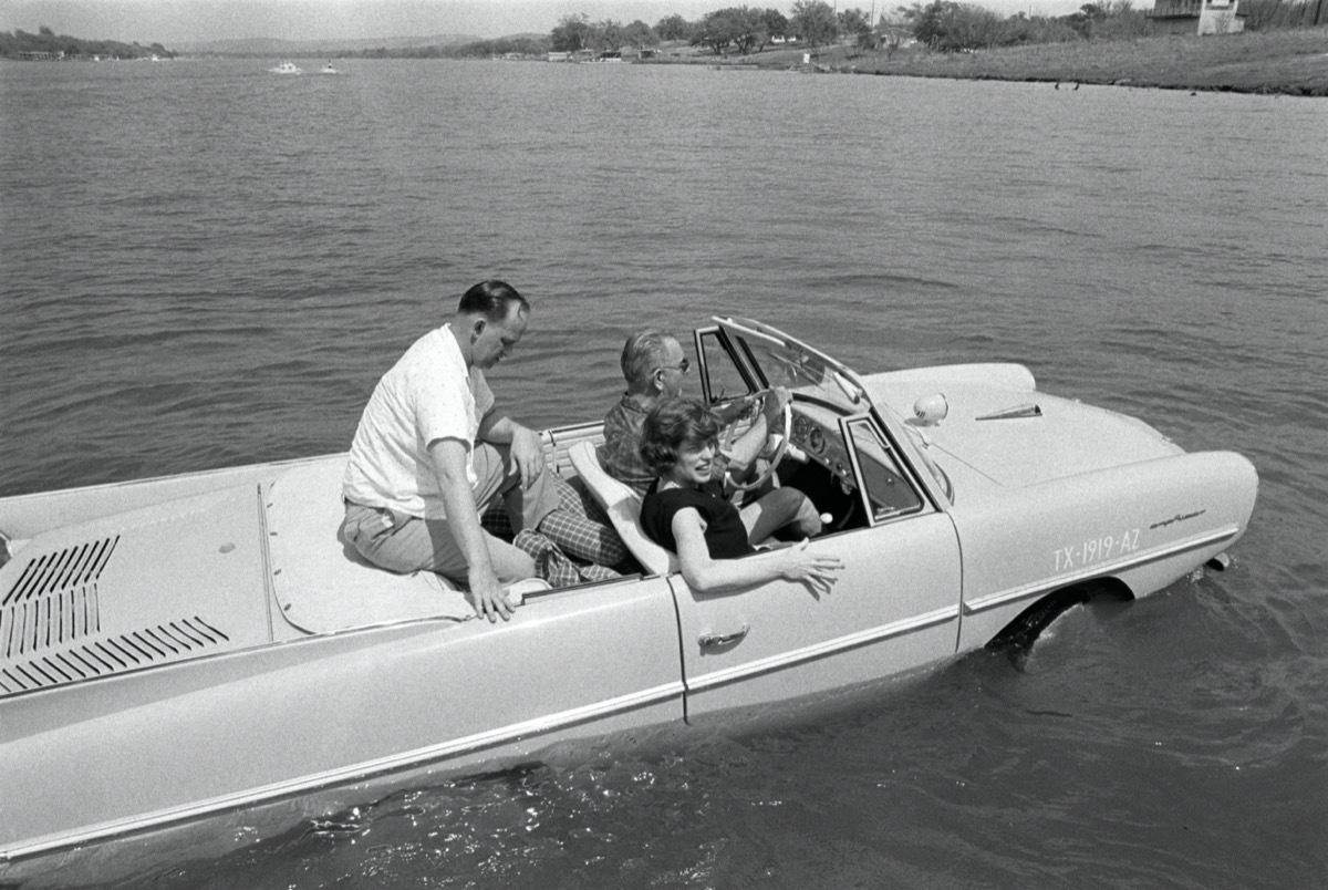 President Lyndon B. Johnson drives his Amphicar with Eunice Kennedy Shriver and Paul Glynn at the Haywood Ranch